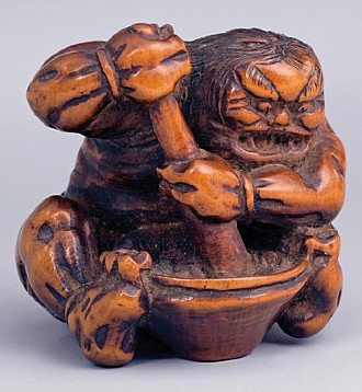 Katabori Netsuke, Oni (Demon) Making Mochi (Rice Paste) 

Signature: Mitsunao 

Wood 

First half of the 19th c. 

Height: 3.6 cm