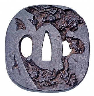 Tsuba (Sword Handguard) 

Shishi Puppy Thrown From a Cliff (Saka Otoshi Shishi) 

Signature: Tsuju (?-1768) of Mito 

Mito School 

Iron 

8.1 x 7.5 cm